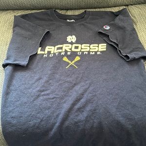 Navy blue Notre Dame lacrosse shirt.